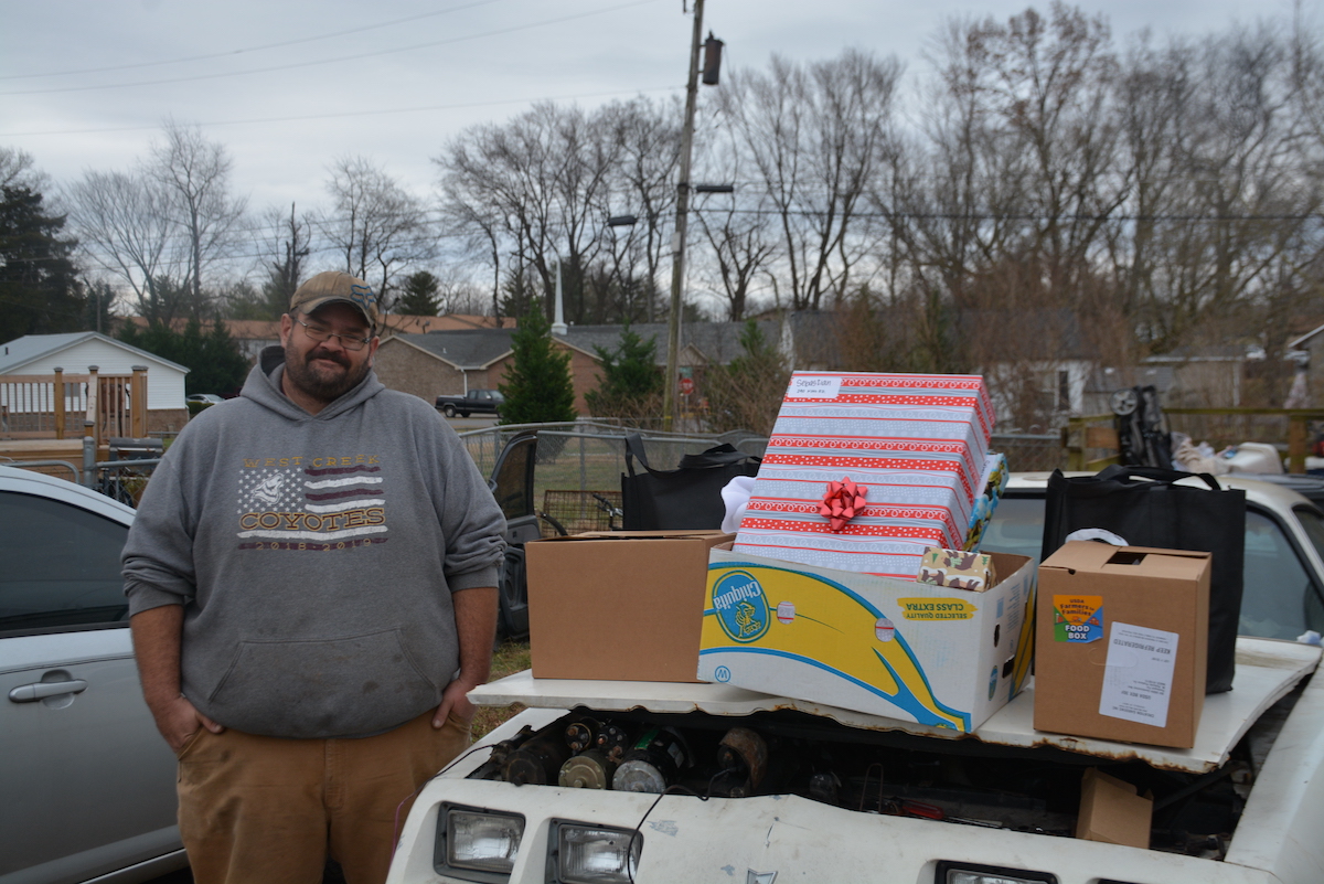 Sebastian, a Campbell Heights resident, with the gifts he received for his family.