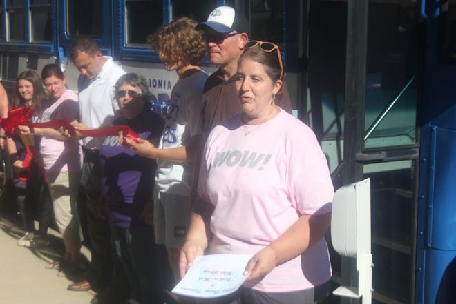 Christina Frost, fifth grade teacher at Rather Elementary School in Ionia, speaks during the grand opening of the Ionia Public Schools Words on Wheels Mobile Library during the First Thursday on the Bricks July 1 in downtown Ionia.