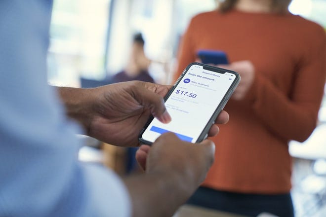 A person using a mobile U.S. Bank app on their smartphone.