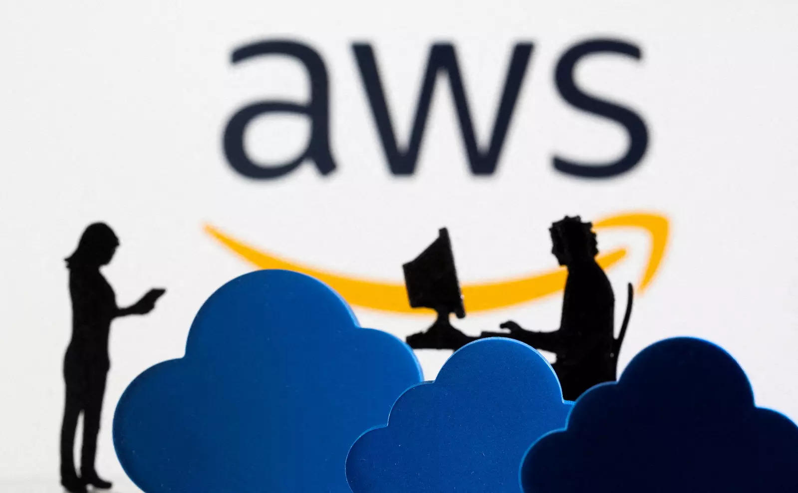  FILE PHOTO: 3D printed clouds and figurines are seen in front of the AWS (Amazon Web Service) cloud service logo in this illustration taken February 8, 2022. REUTERS/Dado Ruvic/Illustration/File Photo