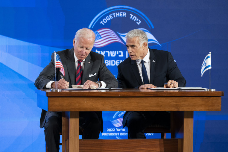 President Joe Biden and Israeli Prime Minister Yair Lapid sign a joint declaration.