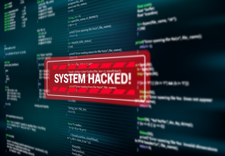 A system hacked warning alert being displayed on a computer screen.