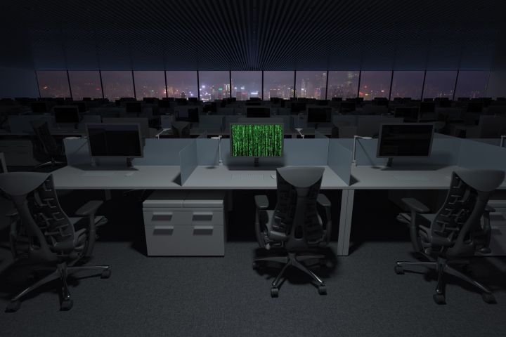 A depiction of a hacked computer sitting in an office full of PCs.