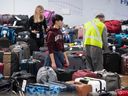 Hundreds of pieces of unclaimed luggage that need to be reunited with their owners sit at YVR on Thursday.