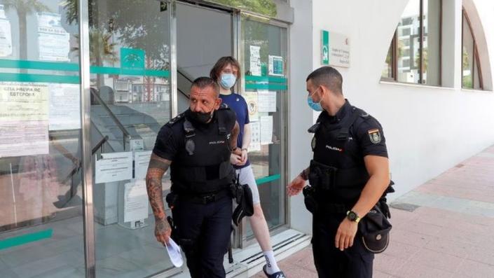 Joseph James O&#39;Connor is lead by Spanish police officers as he leaves a court after being arrested in 2021