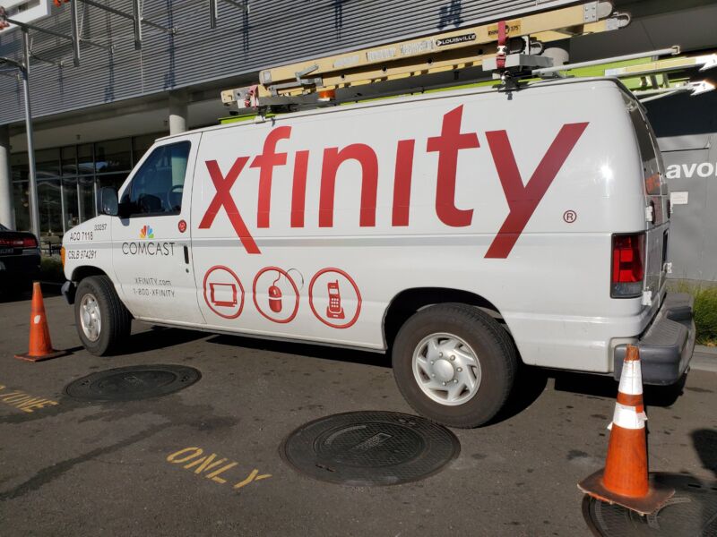 A parked Comcast service van with the 