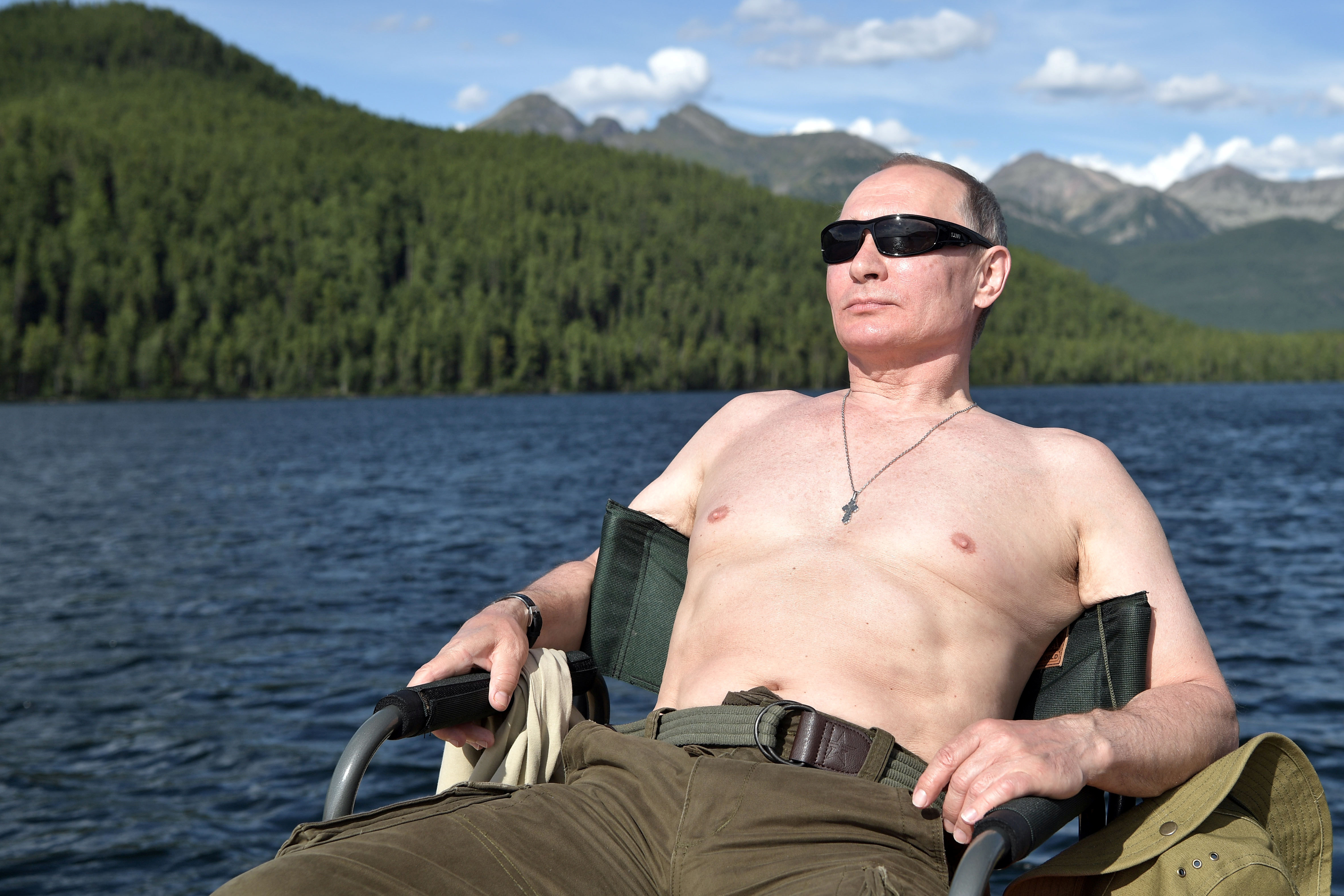 Putin relaxes after fishing during the hunting and fishing trip in 2017